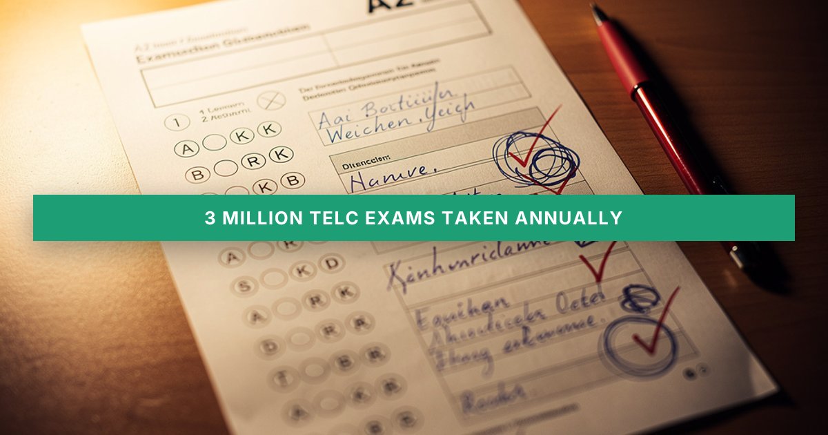 A corrected German exam answer sheet with a red pen rests on a warmly lit wooden desk, text intentionally blurred.
